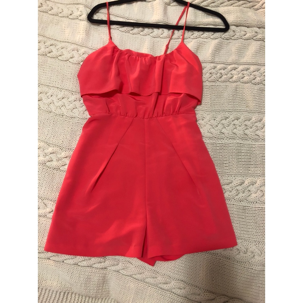 Coral pink romper with ruffled top